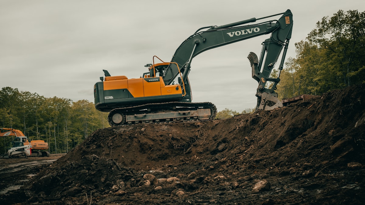 Excavator digging up the collapsed sewer line