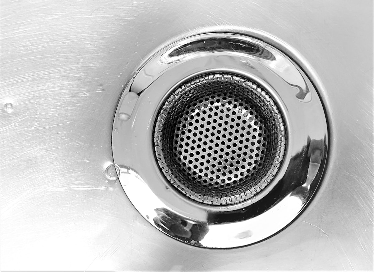 Close-up of a sink drain and strainer